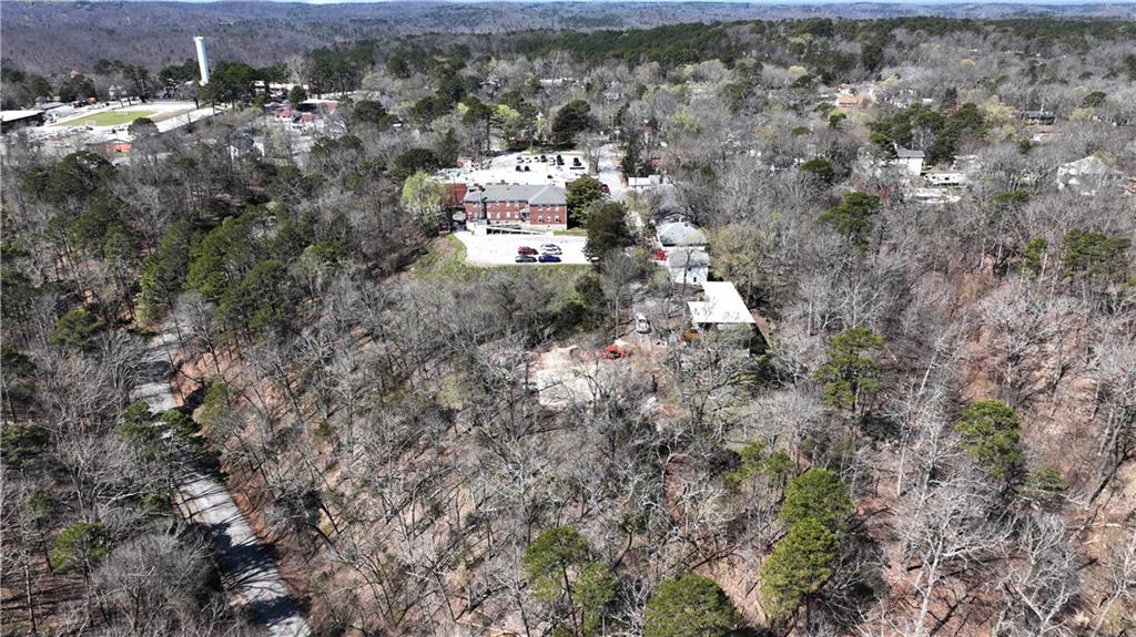 Wider aerial view with Eureka Springs Hospital and parking lot
